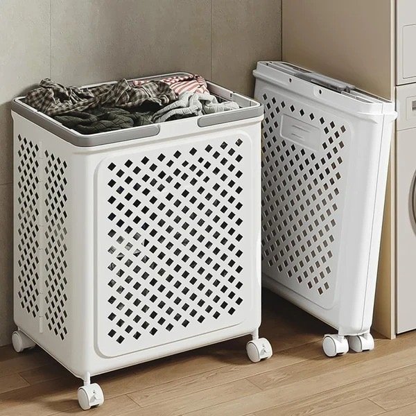 White rolling laundry basket with diamond-pattern ventilation holes, grey handles and four wheels, filled with clothes